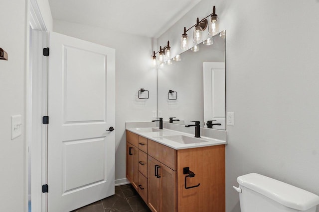 N6285 Blarney Stone Dr, Albany, WI 53520 - bathroom with a sink, toilet, double vanity, and marble finish floor