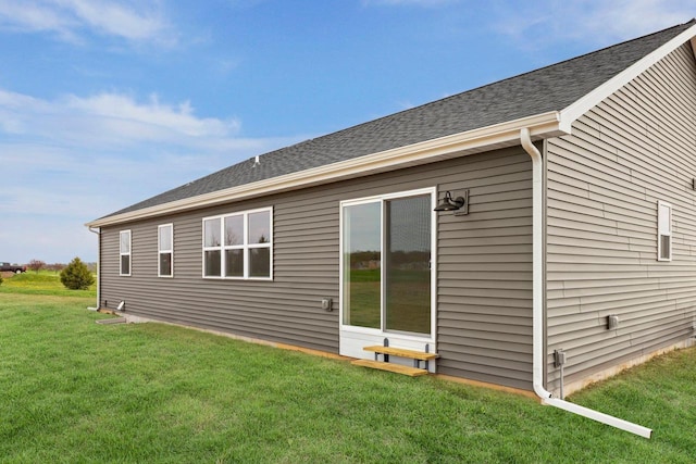 N6285 Blarney Stone Dr, Albany, WI 53520 - rear view of property with a lawn and a shingled roof