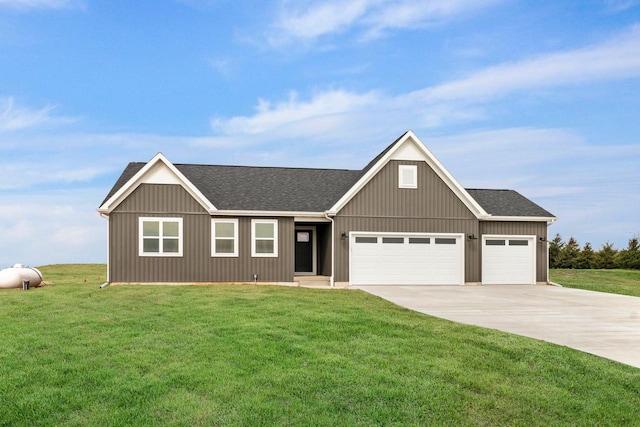 N6285 Blarney Stone Dr, Albany, WI 53520 - view of front of house with a shingled roof, an attached garage, concrete driveway, and a front yard