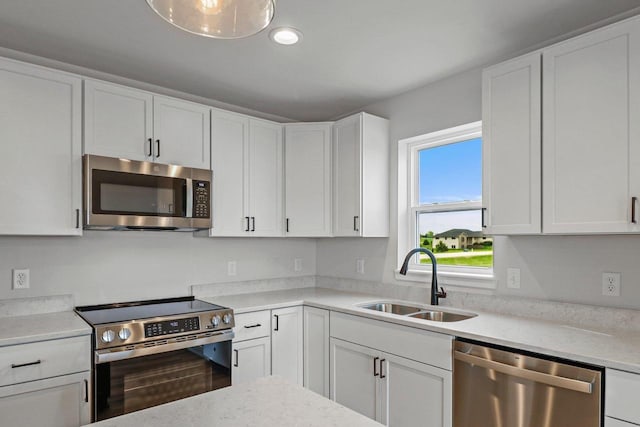 N6285 Blarney Stone Dr, Albany, WI 53520 - kitchen with white cabinets, stainless steel appliances, recessed lighting, and a sink