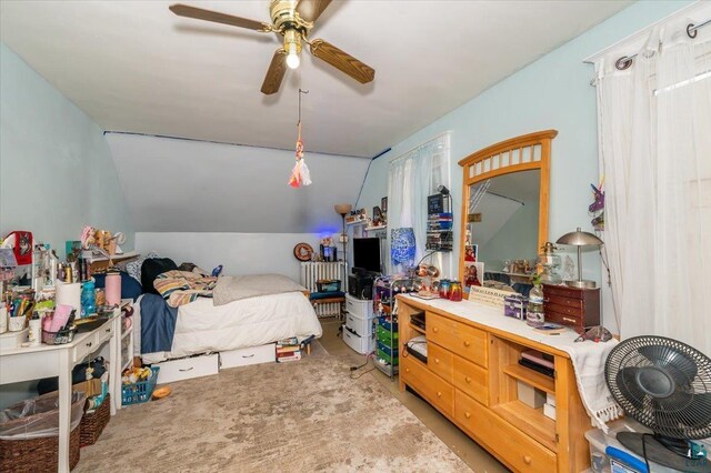 bedroom with ceiling fan and vaulted ceiling