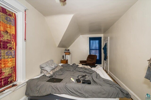 bedroom featuring lofted ceiling