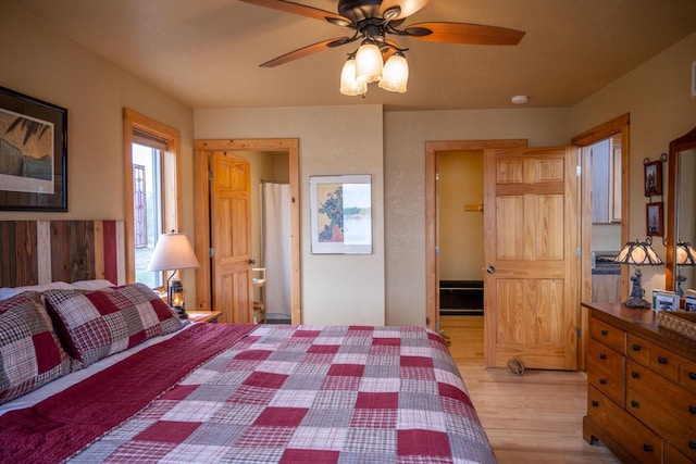 W5588 S Stone Gate Dr, New Lisbon, WI 53950 - bedroom featuring ceiling fan and light wood-type flooring