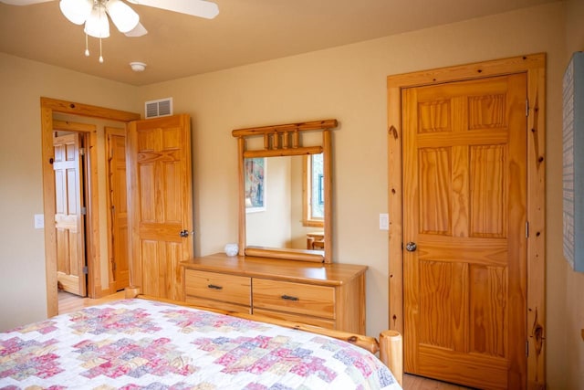 W5588 S Stone Gate Dr, New Lisbon, WI 53950 - bedroom featuring a ceiling fan, light wood-type flooring, and visible vents