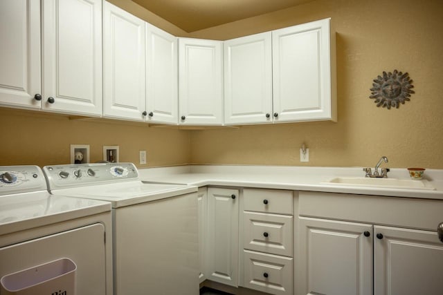 W5588 S Stone Gate Dr, New Lisbon, WI 53950 - laundry room featuring a sink, cabinet space, and washer and dryer