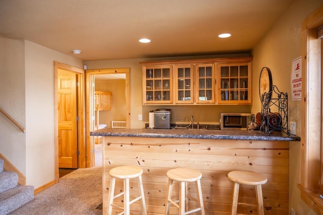 W5588 S Stone Gate Dr, New Lisbon, WI 53950 - bar with stairs, a sink, recessed lighting, stainless steel microwave, and carpet flooring