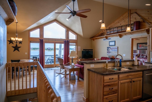 W5588 S Stone Gate Dr, New Lisbon, WI 53950 - kitchen with wood finished floors, dishwasher, a sink, ceiling fan with notable chandelier, and open floor plan