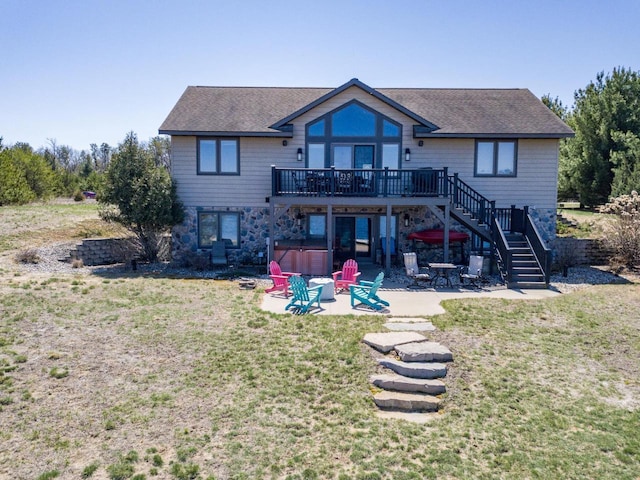 W5588 S Stone Gate Dr, New Lisbon, WI 53950 - back of house featuring a wooden deck, a patio, roof with shingles, a hot tub, and stairway