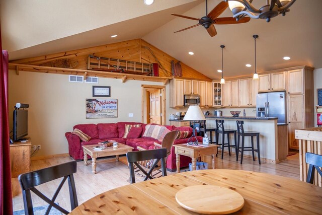 W5588 S Stone Gate Dr, New Lisbon, WI 53950 - living room featuring visible vents, high vaulted ceiling, ceiling fan with notable chandelier, recessed lighting, and light wood-style flooring