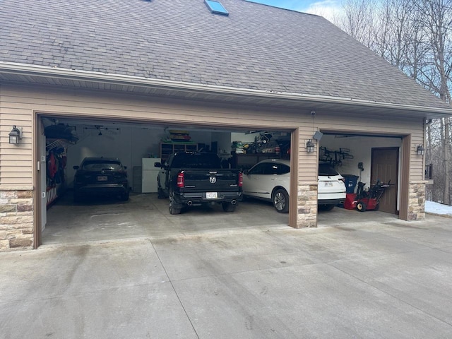 garage with concrete driveway