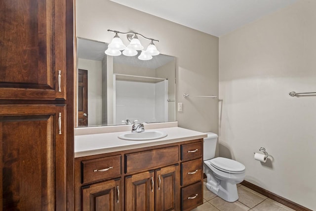 bathroom featuring toilet, baseboards, tile patterned flooring, and vanity