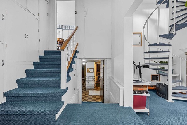 812 Milwaukee St, Kewaunee, WI 54216 - staircase featuring carpet floors and a towering ceiling