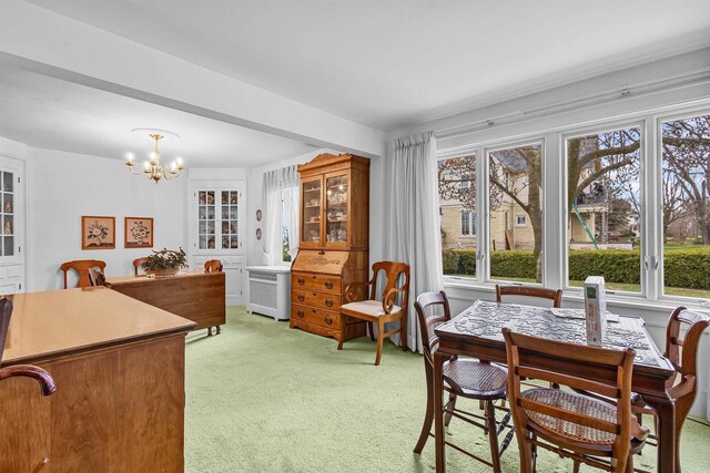812 Milwaukee St, Kewaunee, WI 54216 - dining area with an inviting chandelier, light carpet, and a healthy amount of sunlight
