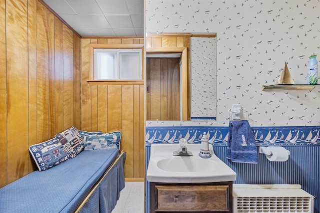 812 Milwaukee St, Kewaunee, WI 54216 - bathroom with wallpapered walls, wood walls, and vanity