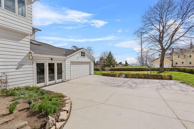 812 Milwaukee St, Kewaunee, WI 54216 - view of patio / terrace featuring an attached garage and concrete driveway
