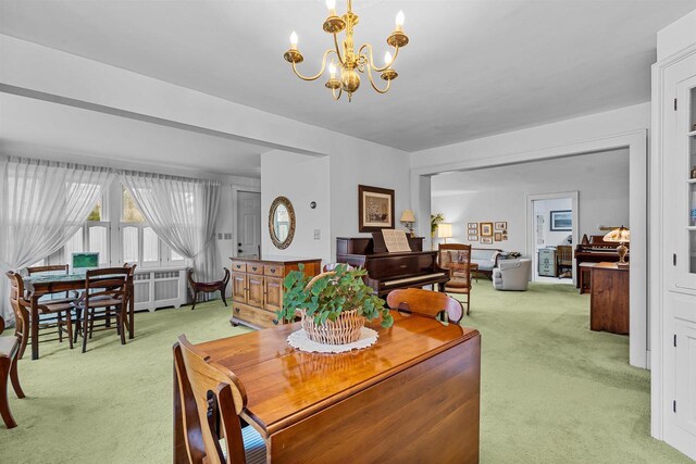 812 Milwaukee St, Kewaunee, WI 54216 - dining area featuring light colored carpet and an inviting chandelier