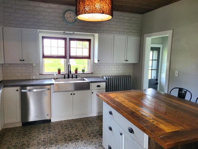 218 7th Ave, New Glarus, WI 53574 - kitchen with a sink, dishwasher, wooden counters, radiator, and decorative backsplash