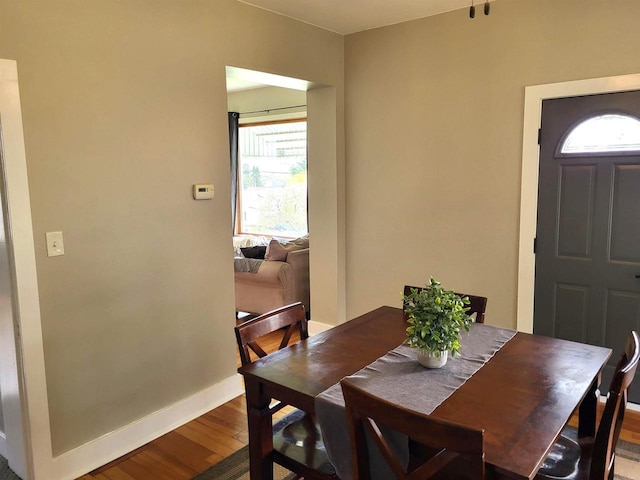 218 7th Ave, New Glarus, WI 53574 - dining area featuring baseboards and wood finished floors