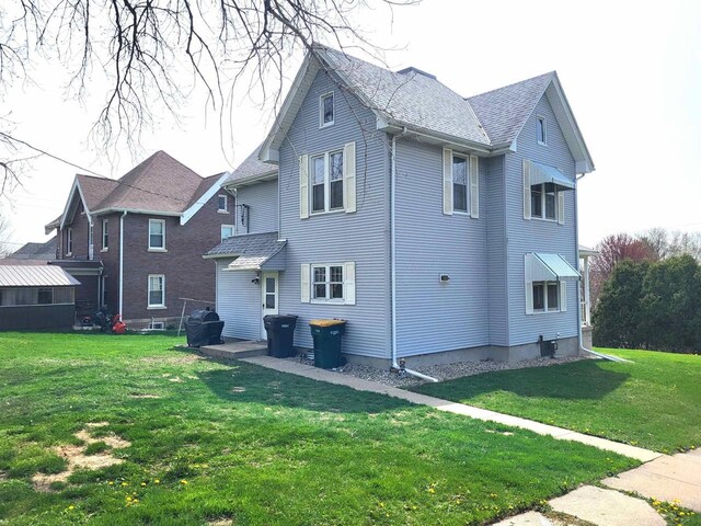 218 7th Ave, New Glarus, WI 53574 - rear view of house with a lawn