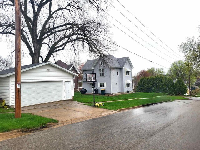 218 7th Ave, New Glarus, WI 53574 - view of front of house featuring an outbuilding and a front yard