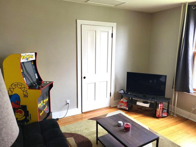 218 7th Ave, New Glarus, WI 53574 - living area featuring baseboards, attic access, and wood finished floors