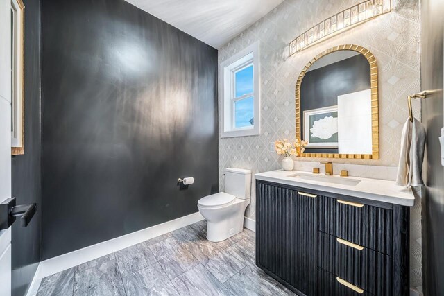1810 White Dove Ln, Kaukauna, WI 54130 - half bathroom with baseboards, vanity, toilet, and marble finish floor