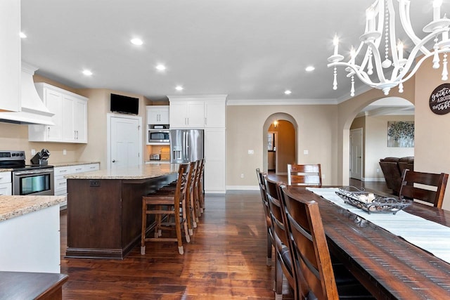 1881 Deer Trail Ct, Luxemburg, WI 54217 - kitchen featuring stainless steel electric range oven, dark wood finished floors, white cabinetry, and arched walkways