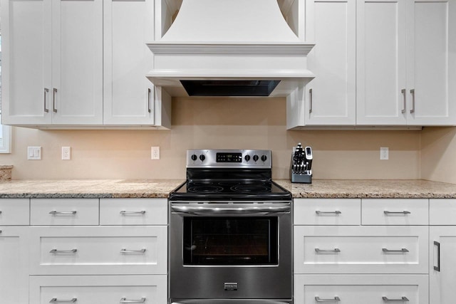 1881 Deer Trail Ct, Luxemburg, WI 54217 - kitchen featuring white cabinets, custom exhaust hood, and stainless steel range with electric stovetop