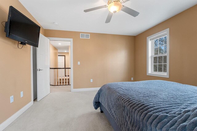 1881 Deer Trail Ct, Luxemburg, WI 54217 - bedroom with baseboards, a ceiling fan, light colored carpet, and visible vents