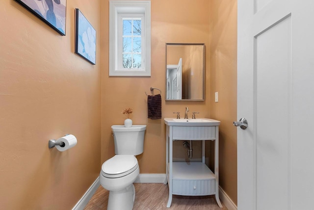 1881 Deer Trail Ct, Luxemburg, WI 54217 - half bathroom with baseboards, a sink, and toilet