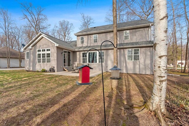 1881 Deer Trail Ct, Luxemburg, WI 54217 - rear view of property with entry steps, a patio, and a lawn