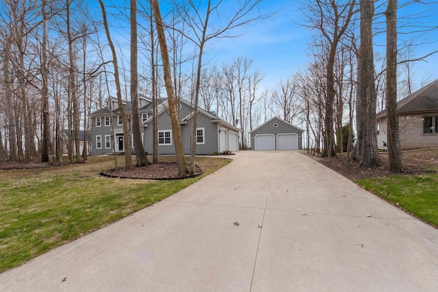 1881 Deer Trail Ct, Luxemburg, WI 54217 - view of front of property featuring concrete driveway, an outbuilding, a front lawn, and a garage