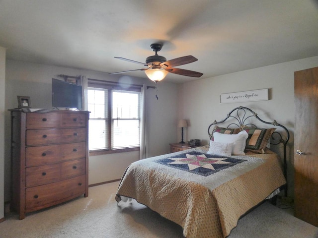 carpeted bedroom featuring a ceiling fan