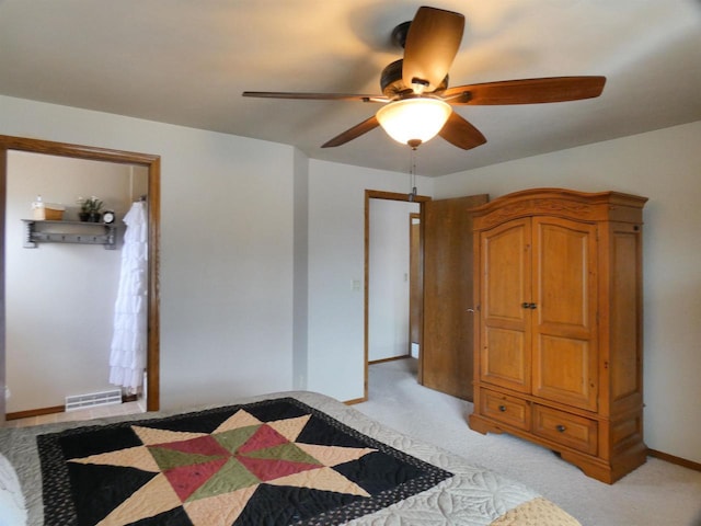 bedroom with baseboards, visible vents, light carpet, and ceiling fan
