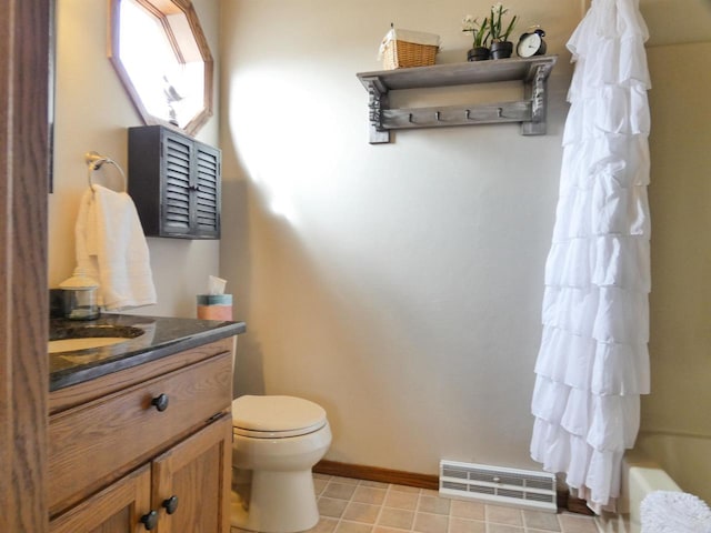 bathroom featuring vanity, baseboards, toilet, and visible vents