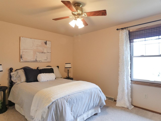 bedroom featuring carpet floors, ceiling fan, and baseboards