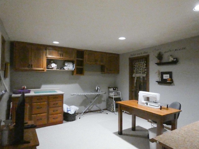 office with light carpet and recessed lighting