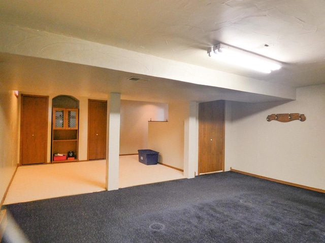 finished basement featuring carpet floors