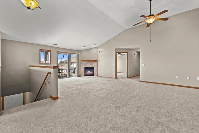 unfurnished living room with baseboards, a ceiling fan, carpet floors, and lofted ceiling