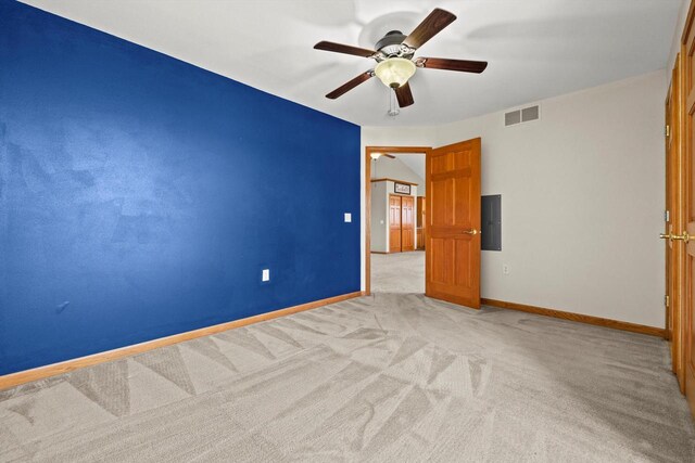 unfurnished bedroom with light colored carpet, baseboards, visible vents, and a ceiling fan