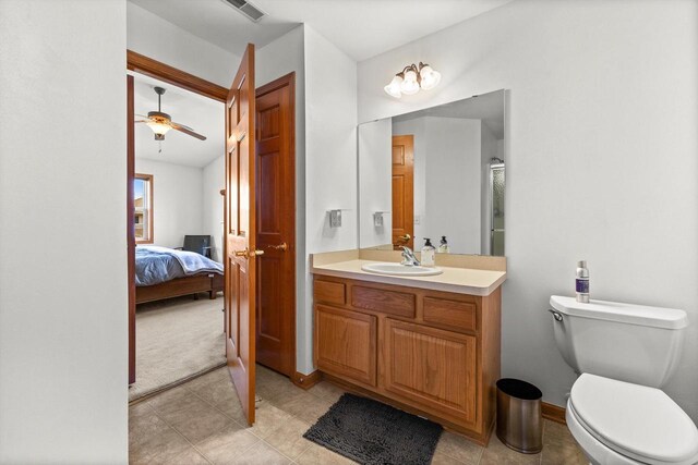 ensuite bathroom with ensuite bath, vanity, toilet, a ceiling fan, and visible vents
