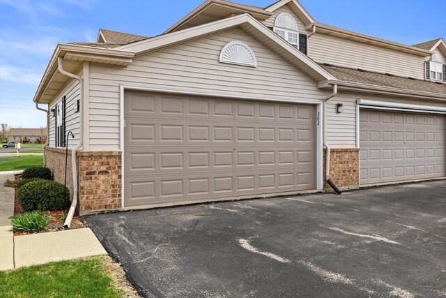 garage featuring driveway
