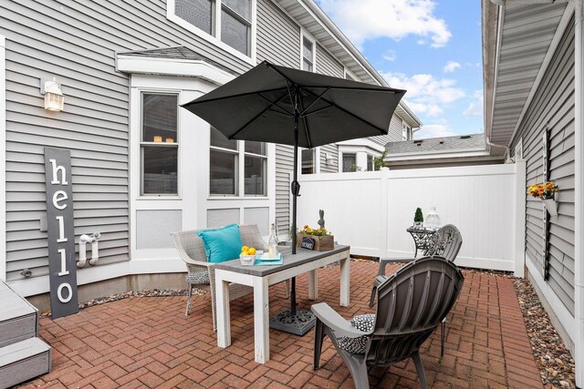 view of patio featuring fence