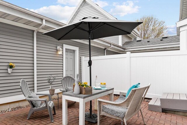 view of patio / terrace featuring fence