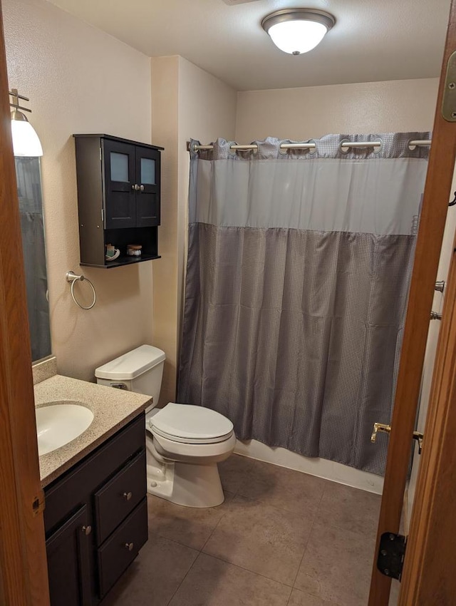 835 Mockingbird Ln, Plymouth, WI 53073 - full bath with vanity, toilet, tile patterned flooring, and shower / bath combo with shower curtain