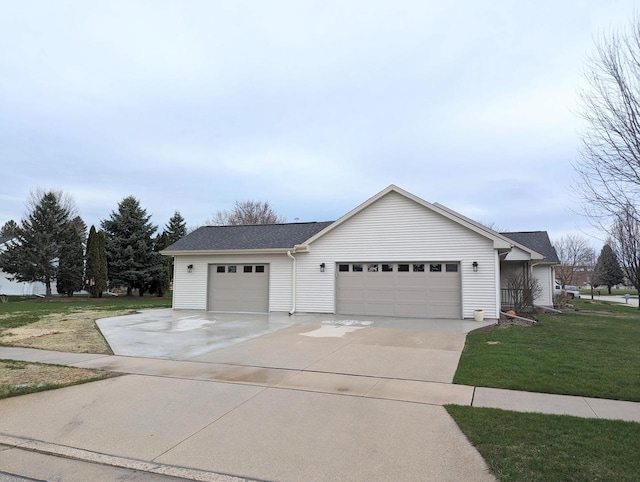 835 Mockingbird Ln, Plymouth, WI 53073 - view of front facade featuring a front yard, driveway, and a garage