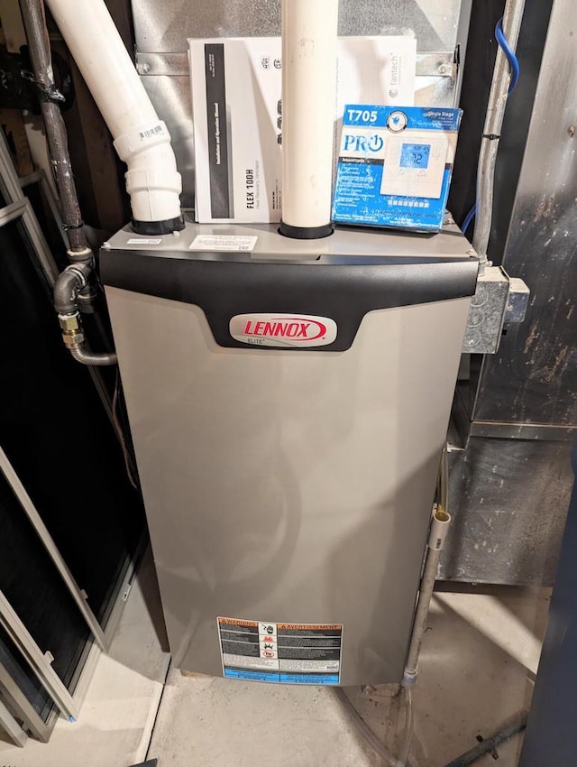 835 Mockingbird Ln, Plymouth, WI 53073 - utility room featuring heating unit