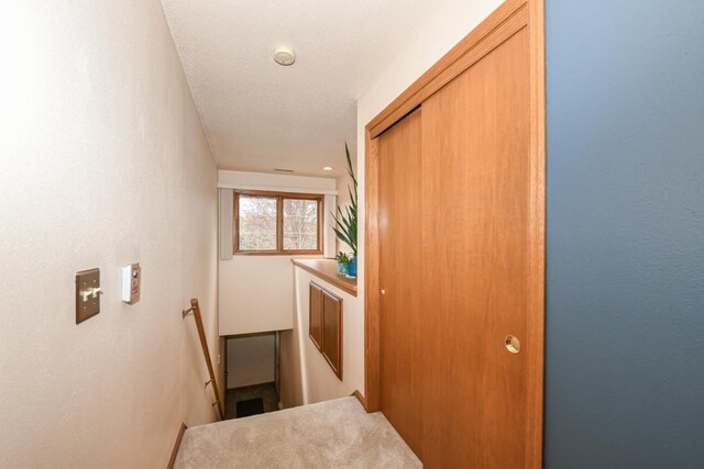 hallway with an upstairs landing