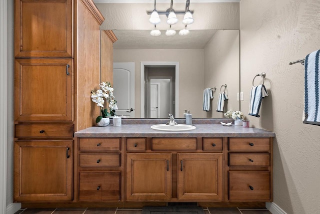 bathroom featuring tile patterned flooring and vanity