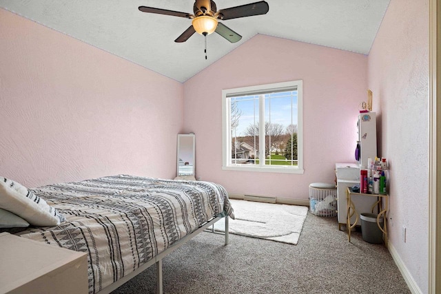 bedroom featuring baseboard heating, carpet, a ceiling fan, baseboards, and lofted ceiling